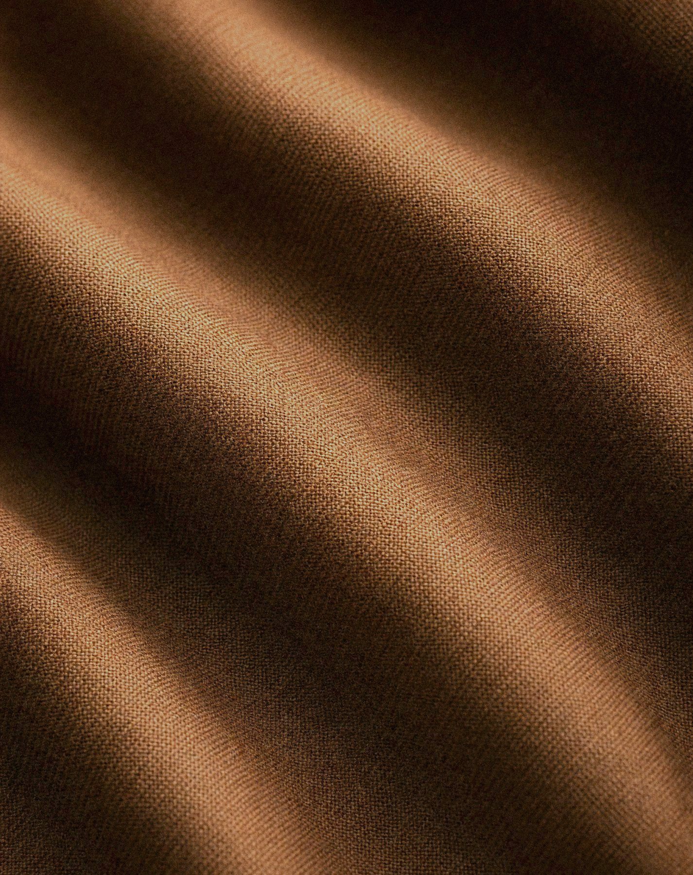 Sand worsted suiting in soft folds